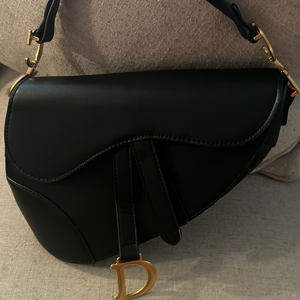 Beautiful CD inspired saddle bag with beautiful reversible crossbody strap.